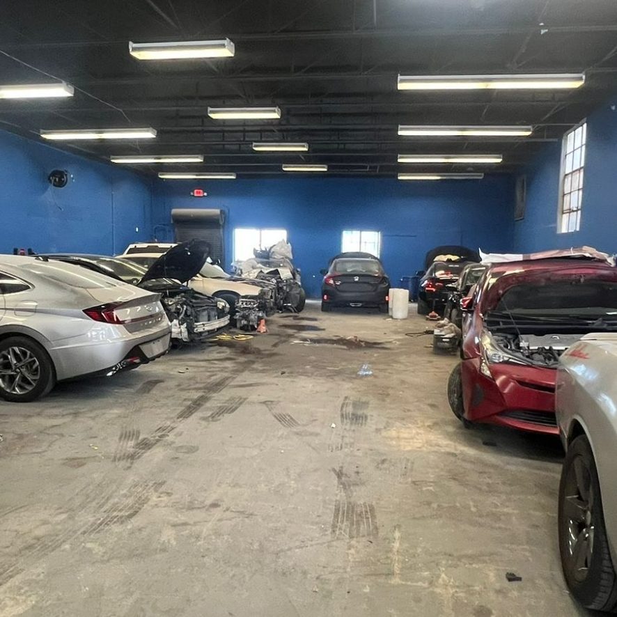 Done Right Collision shop floor in Miami with vehicles mid-repair