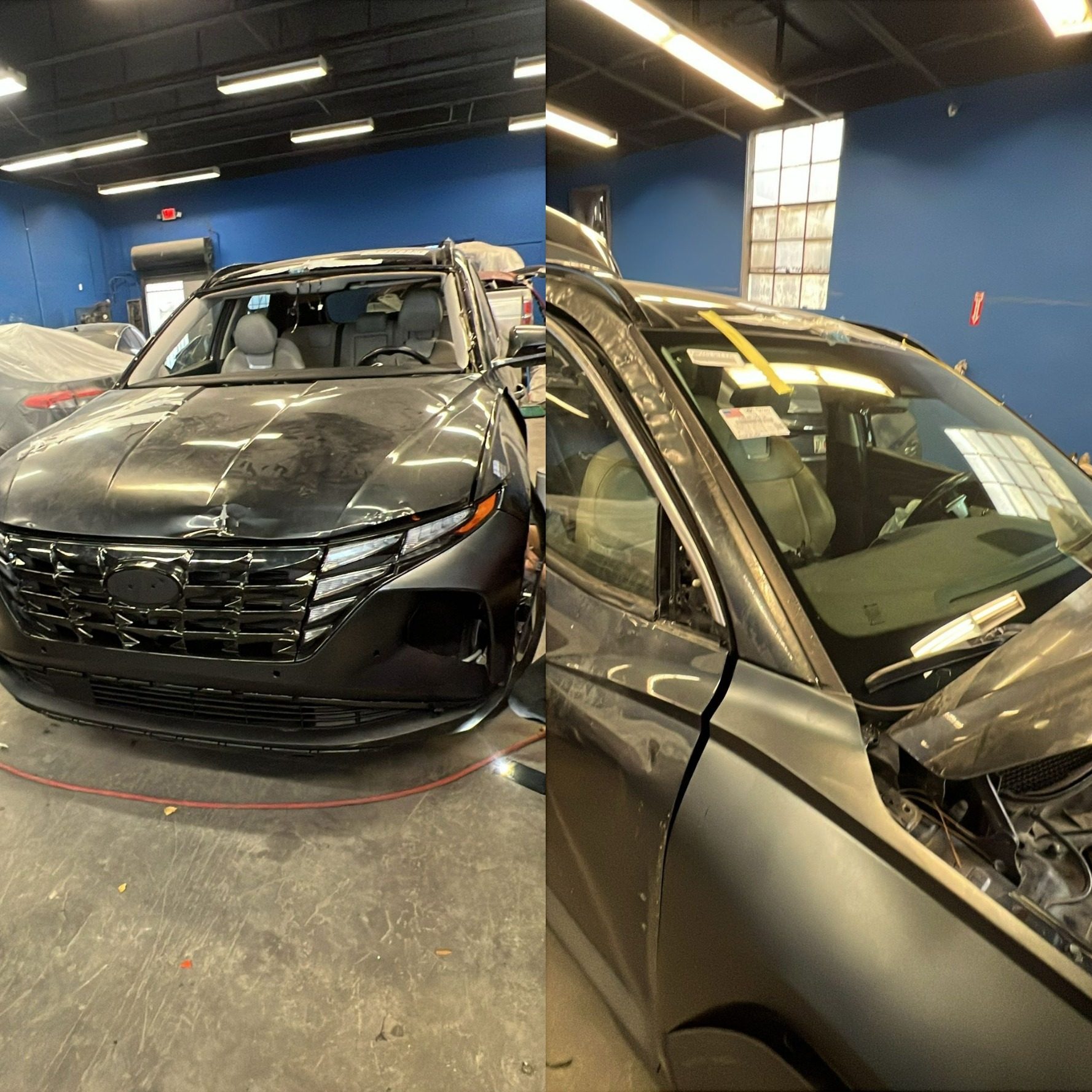 Collision-damaged SUV at intake, before repair begins